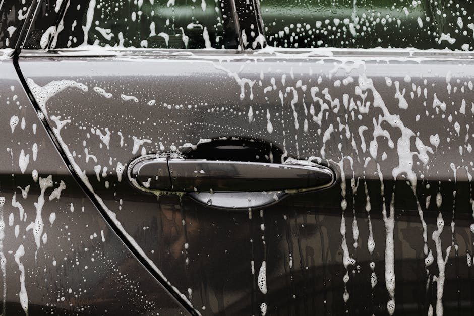 Car covered in thick cleaning foam