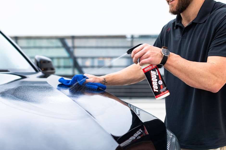 Microfiber cloth wiping the car exterior perfectly clean